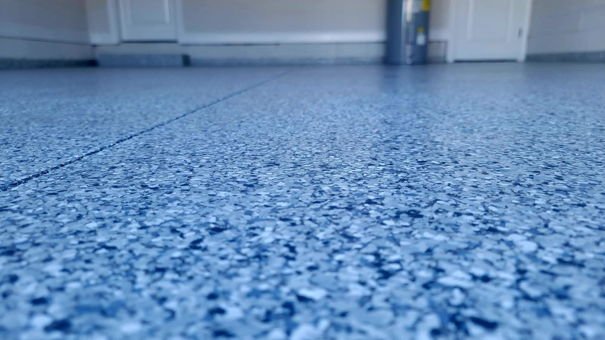 Blue speckled epoxy floor in a commercial space